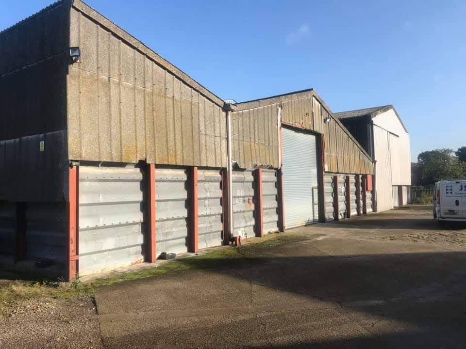 Tired farm building cladding before refurbishment