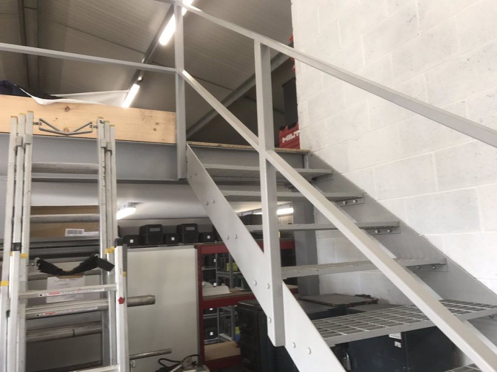 Fabricated steel staircase serving a mezzanine floor