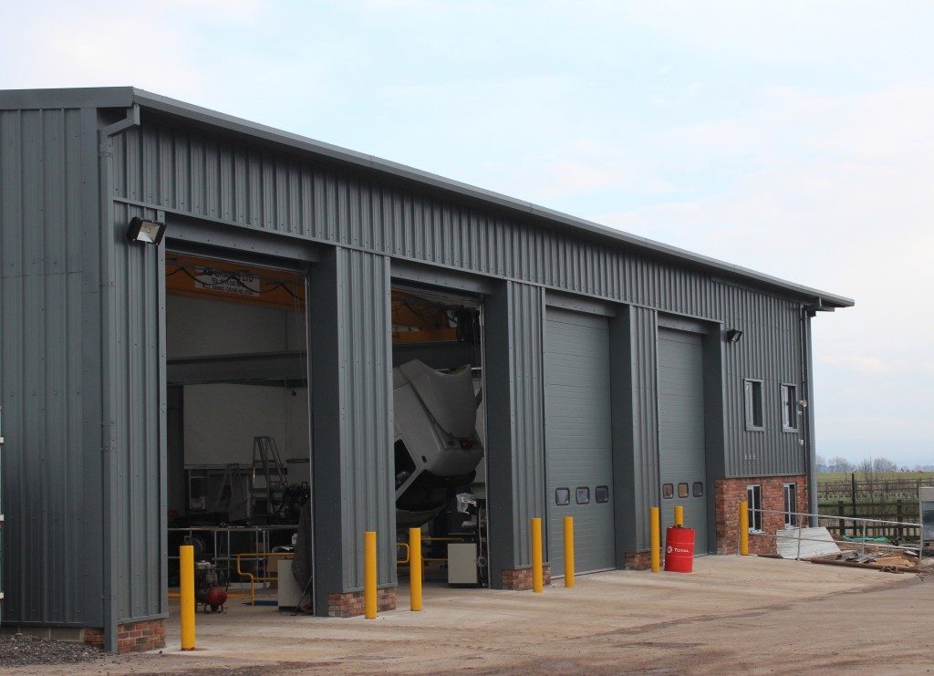 Industrial building development clad with merlin grey composite roof panels